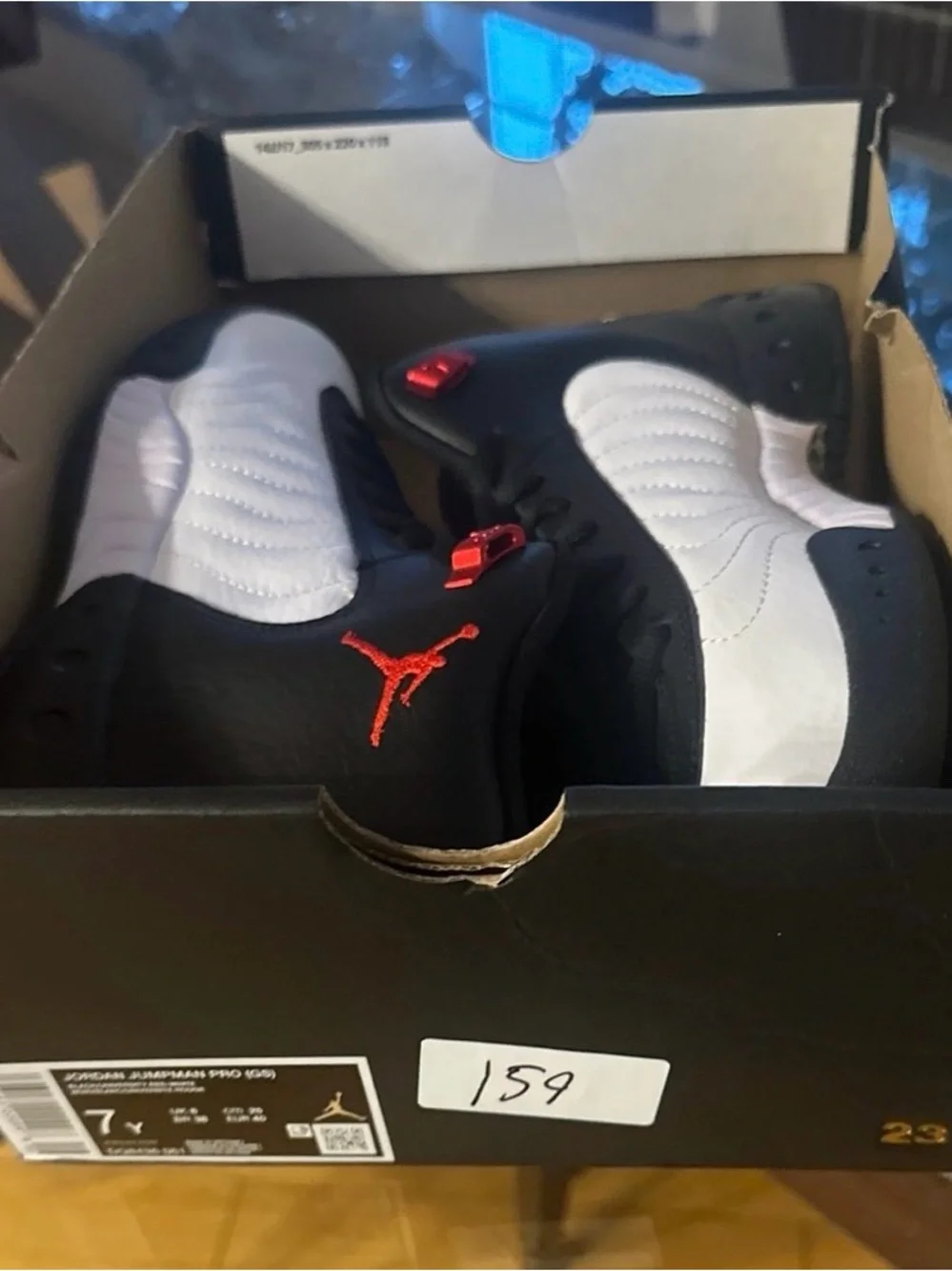 Jordan Men’s Mid Sneaker - Black/White/Red New. Original box is broken.